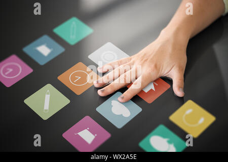 hand using interactive panel with app icons on it Stock Photo