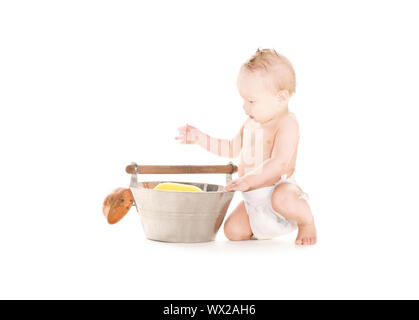 picture of baby boy with wash-tub and scoop over white Stock Photo