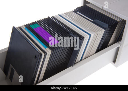 Several computer diskettes in a storage box, isolated on white Stock Photo