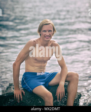 Healthy fitness man near the sea Stock Photo