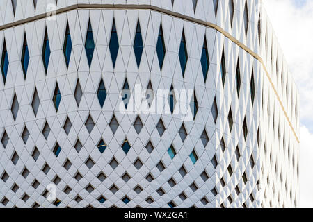 Closeup View Of White Panels And Parametric Facade. Building Made From Stretched White Tile. Stock Photo