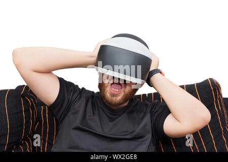 Bearded man wearing virtual reality goggles on white isolated background Stock Photo