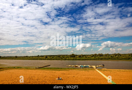 Summer landscape: river and sandy beach on the shore. Stock Photo