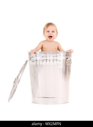 picture of adorable baby in trash can Stock Photo