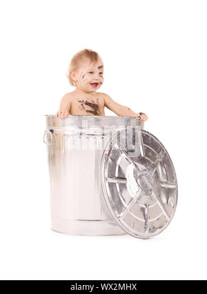 picture of adorable baby in trash can Stock Photo