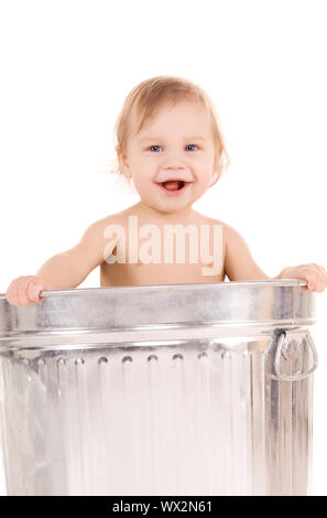 picture of adorable baby in trash can Stock Photo