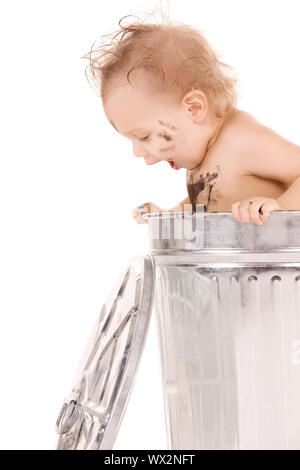 picture of adorable baby in trash can Stock Photo