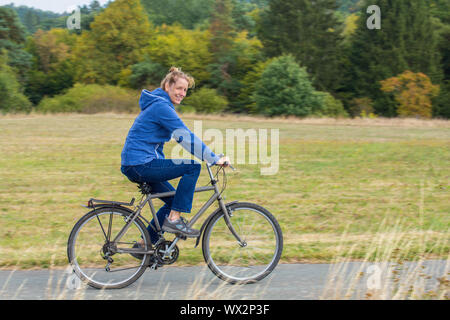 Dutch woman cycling on mountain bike Stock Photo