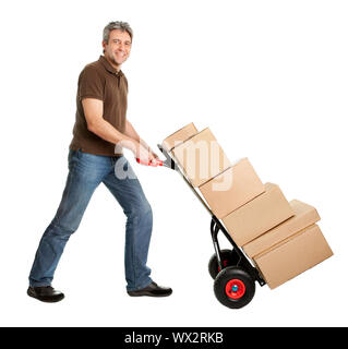 Delivery man pushing hand truck and stack of boxes Stock Photo