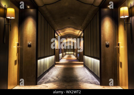 Long dark hotel corridor Stock Photo