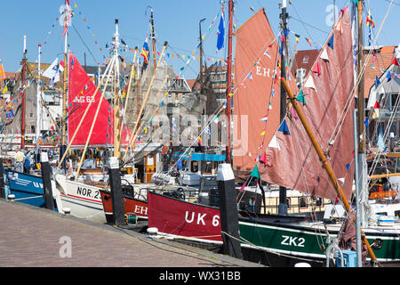 Decorated traditional fishing ships in the harbor of Urk, the Netherlands Stock Photo