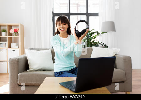 female blogger with headphones making video blog Stock Photo