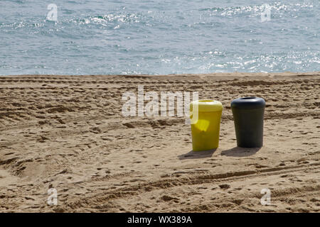 Ocean and trash cans - fighting plastic pollution Stock Photo