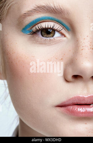 Closeup shot of  human female face. Woman with vogue face beauty makeup. Stock Photo
