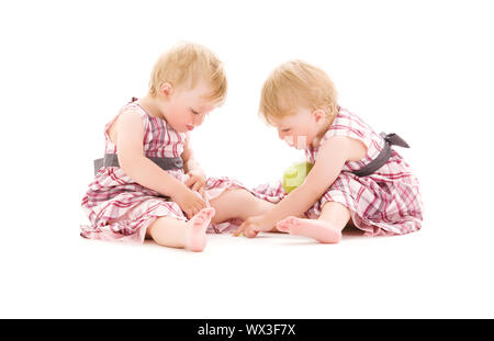 picture of two adorable twins over white Stock Photo