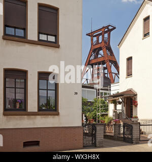 Residential buildings with the winding tower of Pluto colliery, Herne, Ruhr Area, Germany, Europe Stock Photo
