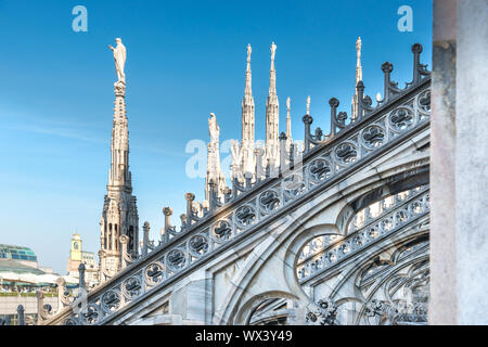 Marble statues - architecture on roof of Duomo cathedral Stock Photo