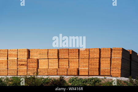 Wood stock outdoor. Stacks of timber planks. Wood industry in Germany Stock Photo