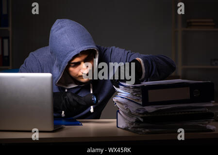 The thief trying to steal personal data in identity theft concept Stock Photo