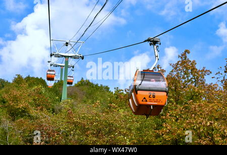 Great Wall of China orange cable cars, Mutianyu, China Stock Photo