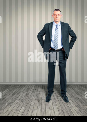 An image of a business man standing in the empty room Stock Photo