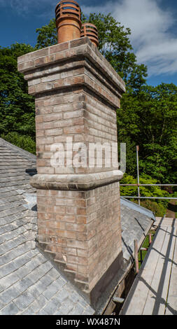 Close up of chimney stack after being re-pointed and with new lead flashing. Stock Photo