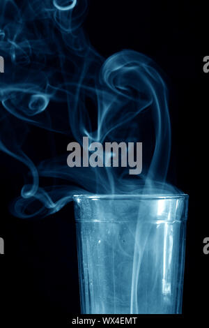 glass and smoke on black background Stock Photo