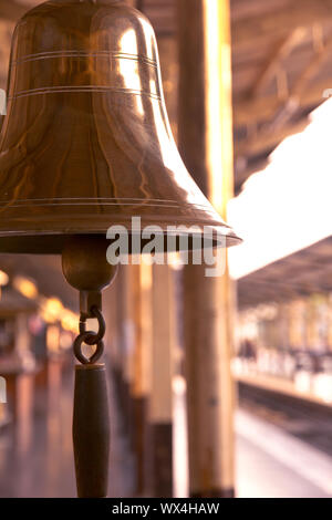old bell in train station with sunrise light Stock Photo
