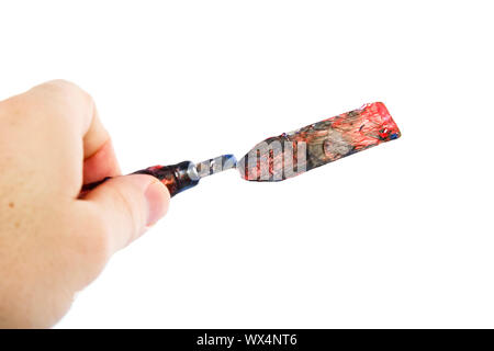 A pallet knife held in a hand.  Isolated on white with clipping path. Stock Photo