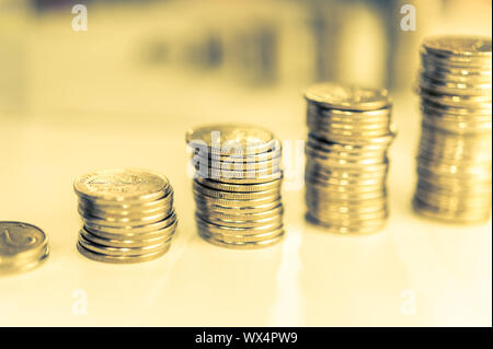 Stack of coins macro. Rows of coins for finance and banking concept. Economy trends background for business idea. Stock Photo