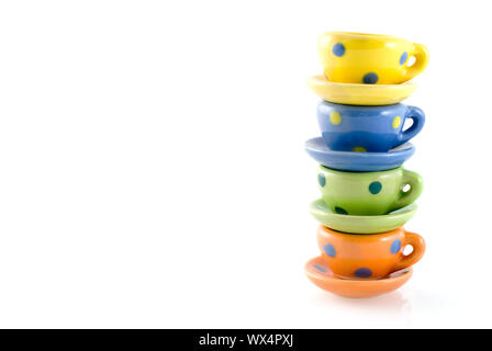 pile of colored cup and saucers Stock Photo