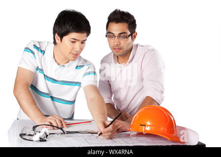 Two architects discussing on blueprints isolated on white background. Stock Photo