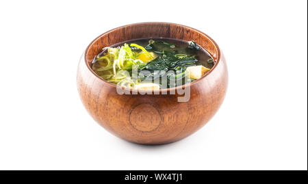 Miso soup japanese traditional meal in wooden bowl isolated on white background Stock Photo