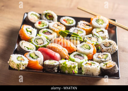 Assortment of japanese sushi rolls nigiri sashimi and maki Stock Photo