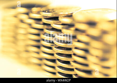 Stack of golden coins macro. Rows of coins for finance and banking concept. Economy trends background for business idea.