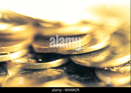 Stack of golden coins macro. Rows of coins for finance and banking concept. Economy trends background for business idea.