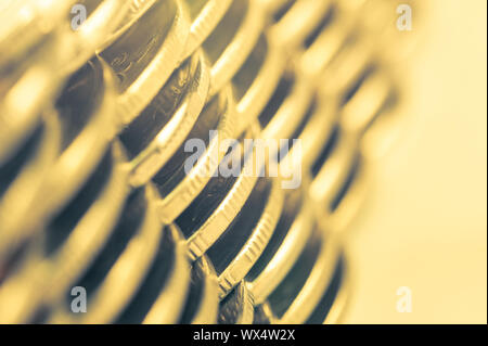 Stack of golden coins macro. Rows of coins for finance and banking concept. Economy trends background for business idea.