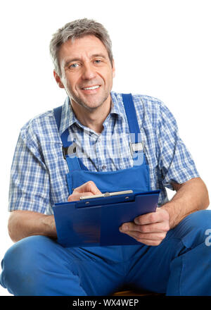 Confident service man taking notes. Isolated on white Stock Photo