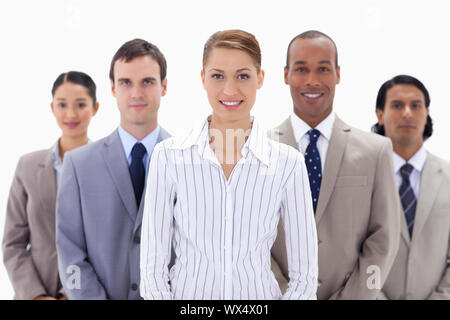 Close-up of a business team a smiling with focus on the woman in the center Stock Photo