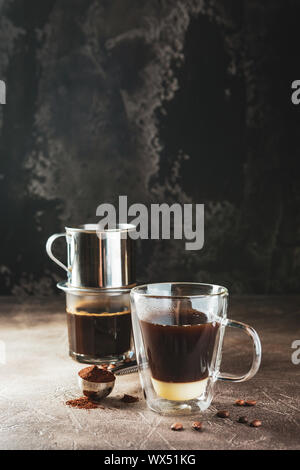 https://l450v.alamy.com/450v/wx51kg/vietnamese-coffee-with-condensed-milk-in-glass-cups-and-traditional-metal-coffee-maker-phin-traditional-method-of-making-of-vietnamese-coffee-space-wx51kg.jpg