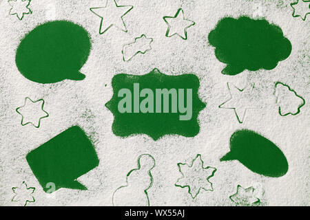 Christmas concept, labels speech bubbles, on snow flour background. Copy space. Top view, flat lay Stock Photo