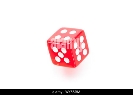 Red dice moving against a white background Stock Photo