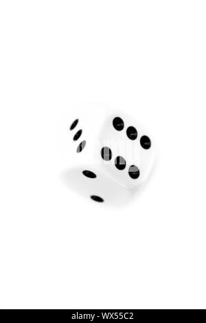 Dice in motion against a white background Stock Photo