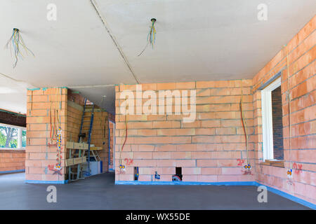 Inside new house with concrete floor in living room Stock Photo