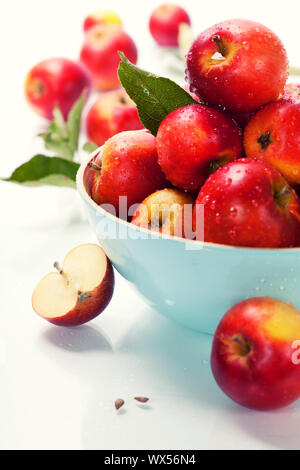 Fresh apples in a bowl over white Stock Photo