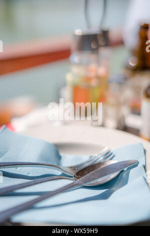 Cutlery on a plate in a restaurant Stock Photo
