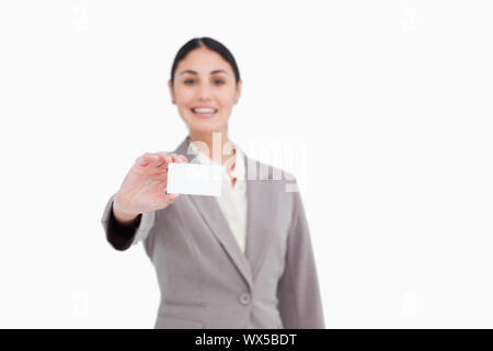 Blank business card being presented by saleswoman against a white background Stock Photo
