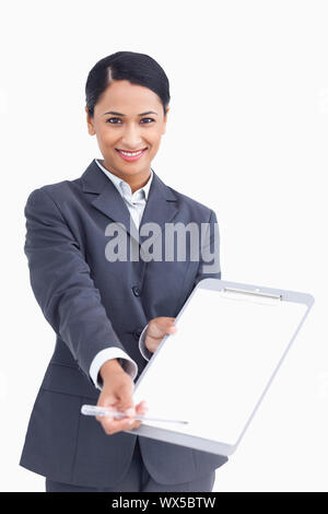 Close up of smiling saleswoman asking for signature Stock Photo