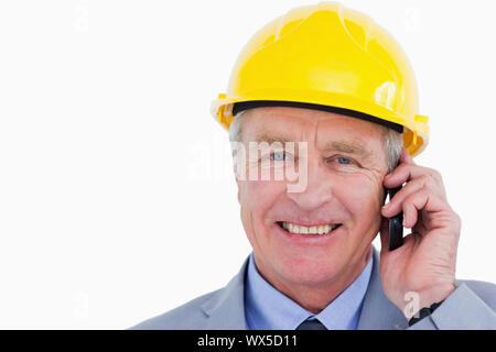 Smiling mature architect on the phone Stock Photo