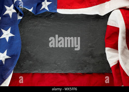 US American flag on black slate stone background. For USA Memorial day, Veteran's day, Labor day, or 4th of July celebration. With blank space for tex Stock Photo